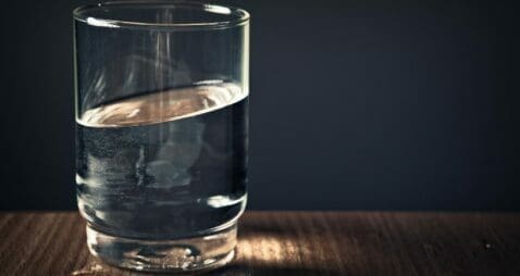 Glass of water on desk